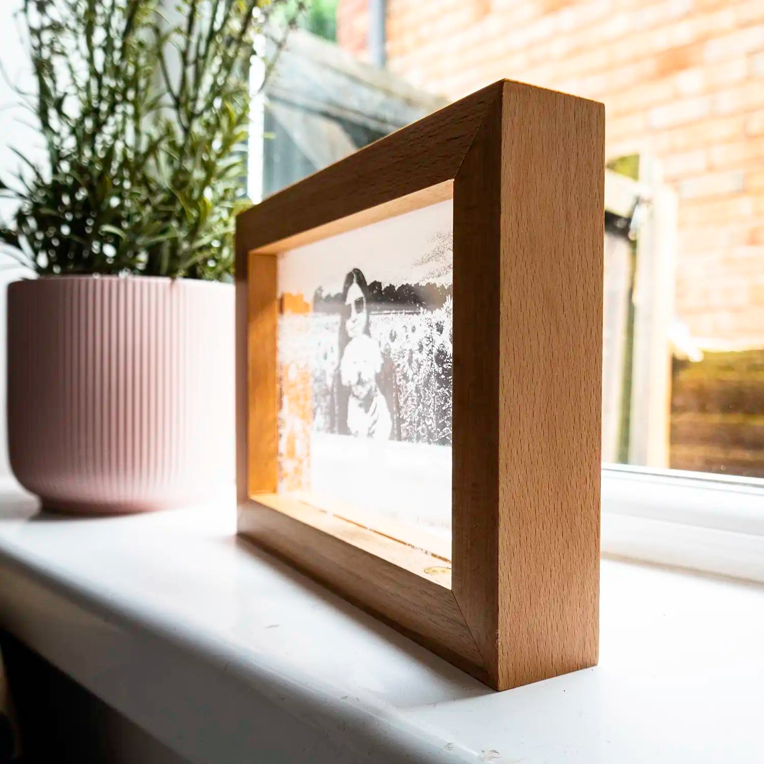 A acrylic LED photograph in wooden frame